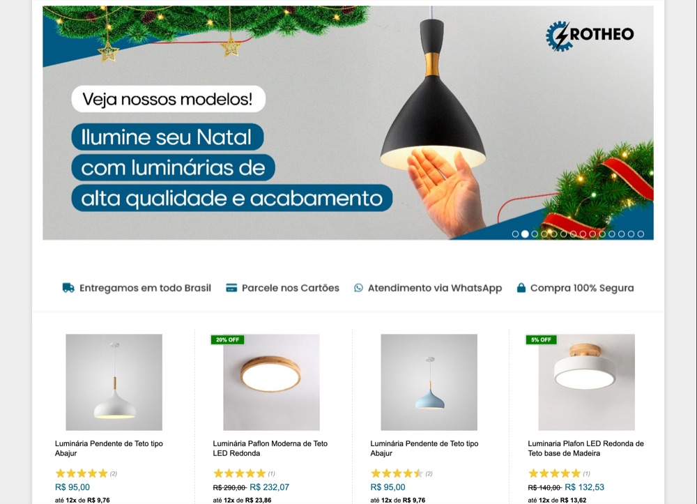 Home antiga da loja Rotheo: banner de Natal com texto em faixas azuis e fotos de produto em fundo cinza